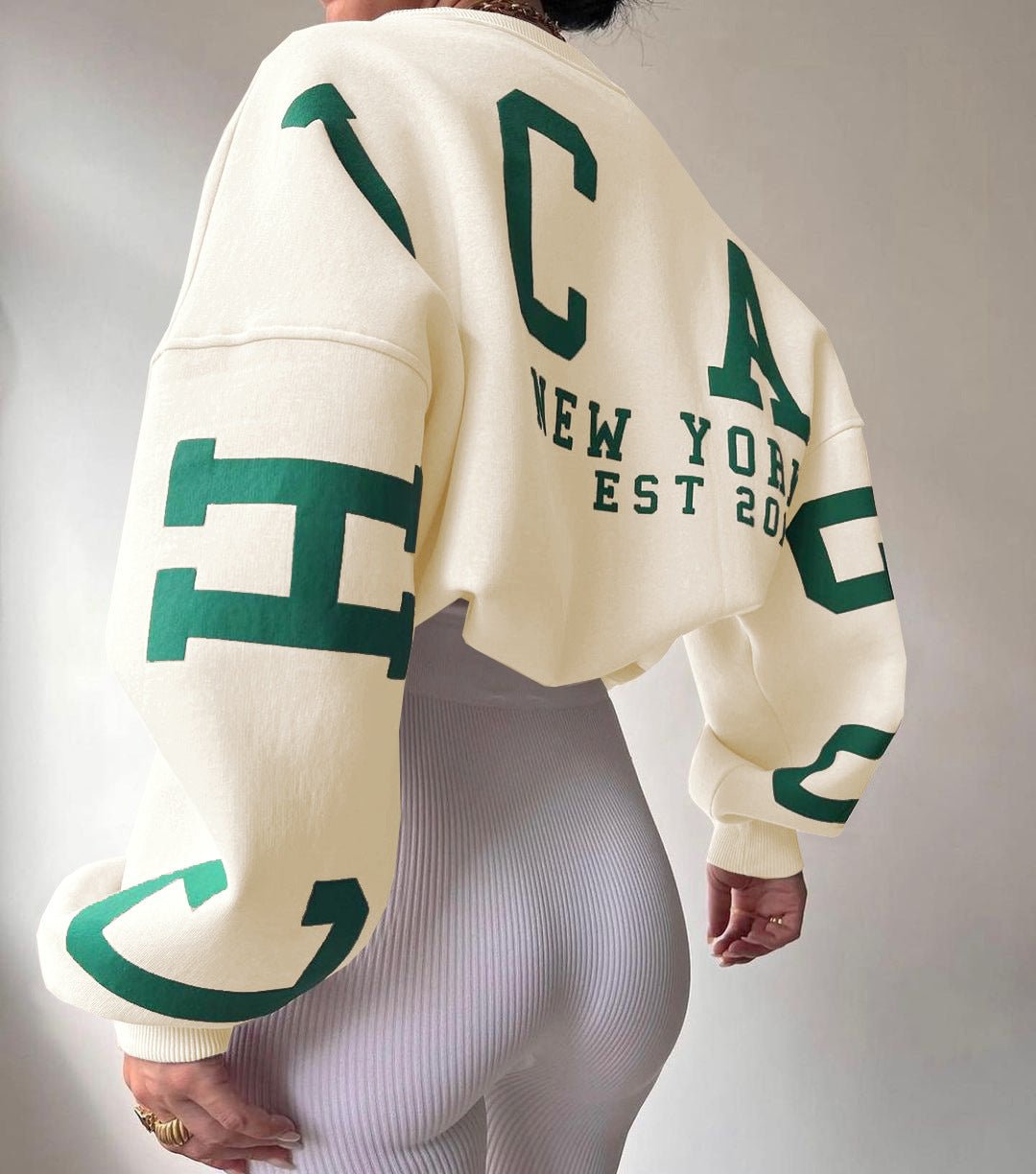 Isla | Maglione girocollo oversize da donna con maniche stile college e fodera in pile 1