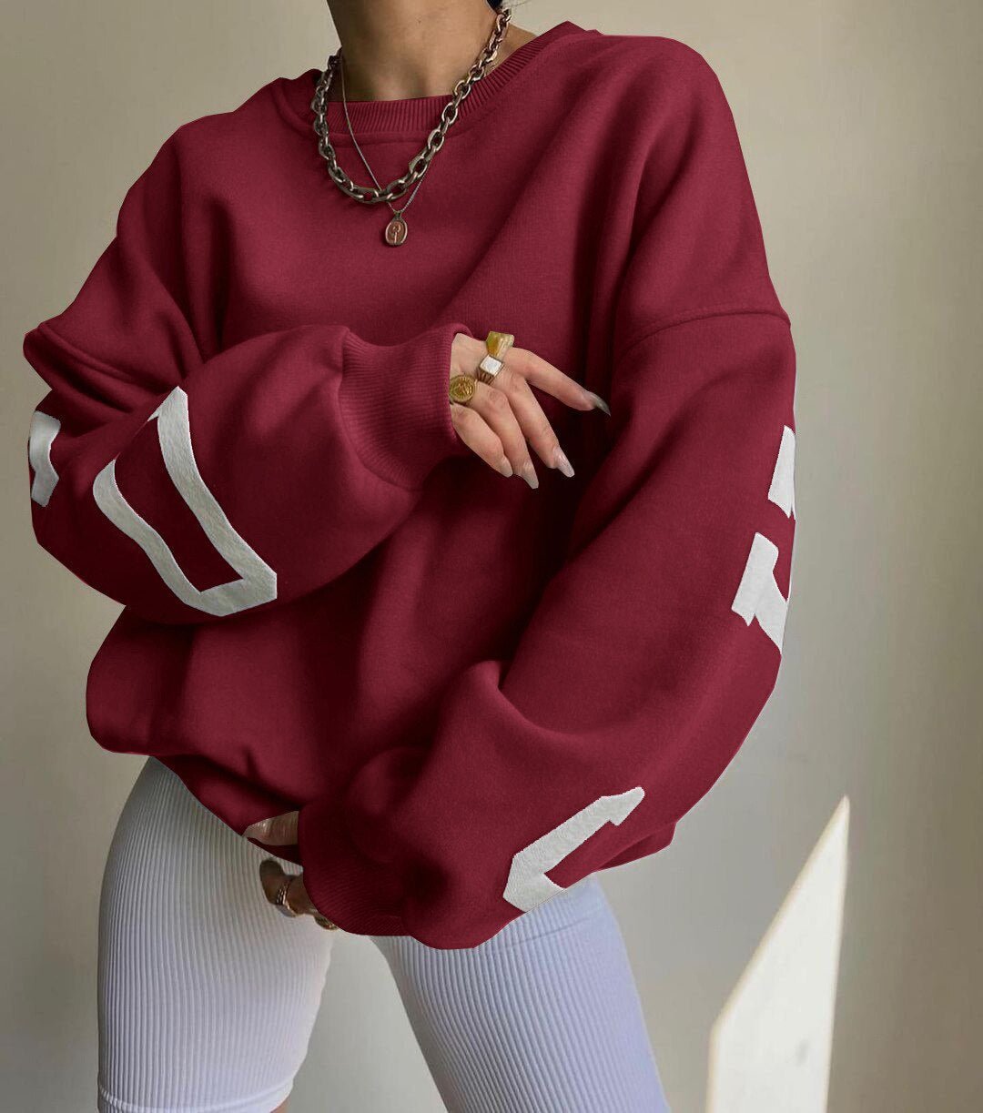Isla | Maglione girocollo oversize da donna con maniche stile college e fodera in pile 5